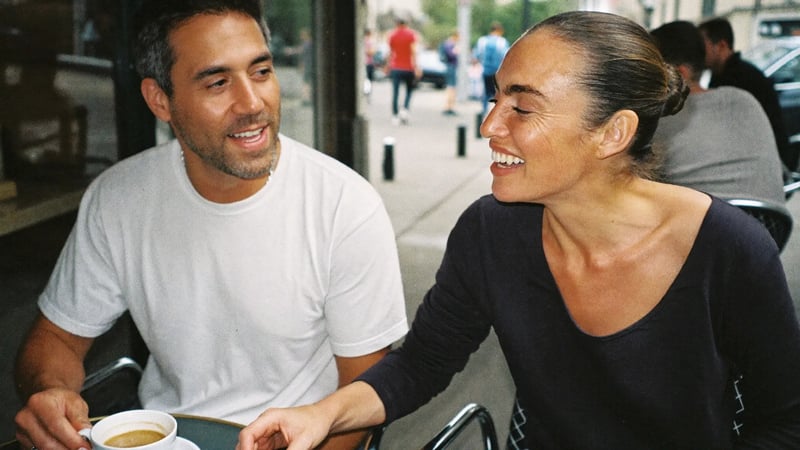 Couple over 40 meeting for a first date at a coffee shop after matching on a dating app